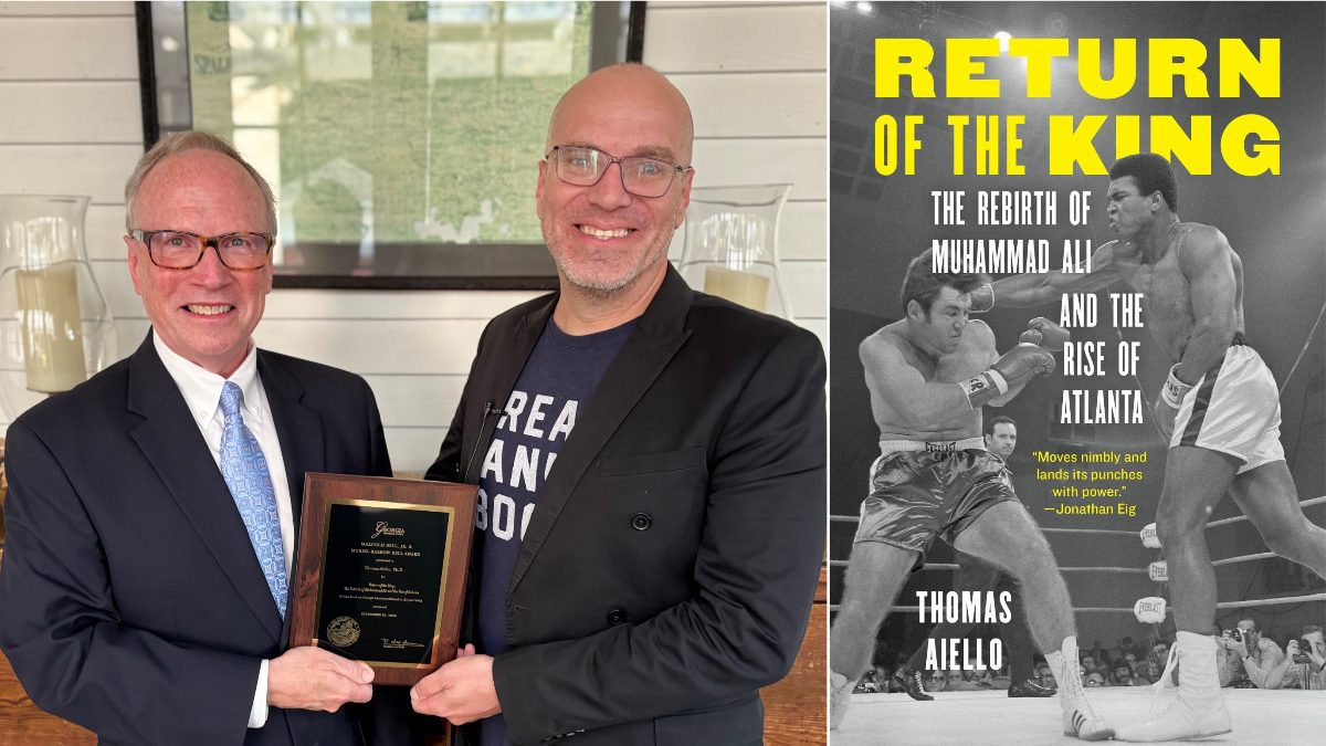 GHS President and CEO Dr. W. Todd Groce presents Dr. Thomas Aiello with the Bell Award for Return of the King: The Rebirth of Muhammad Ali and the Rise of Atlanta during a UGA Griffin Campus book talk at the Bailey-Tebault House in Griffin, Georgia.