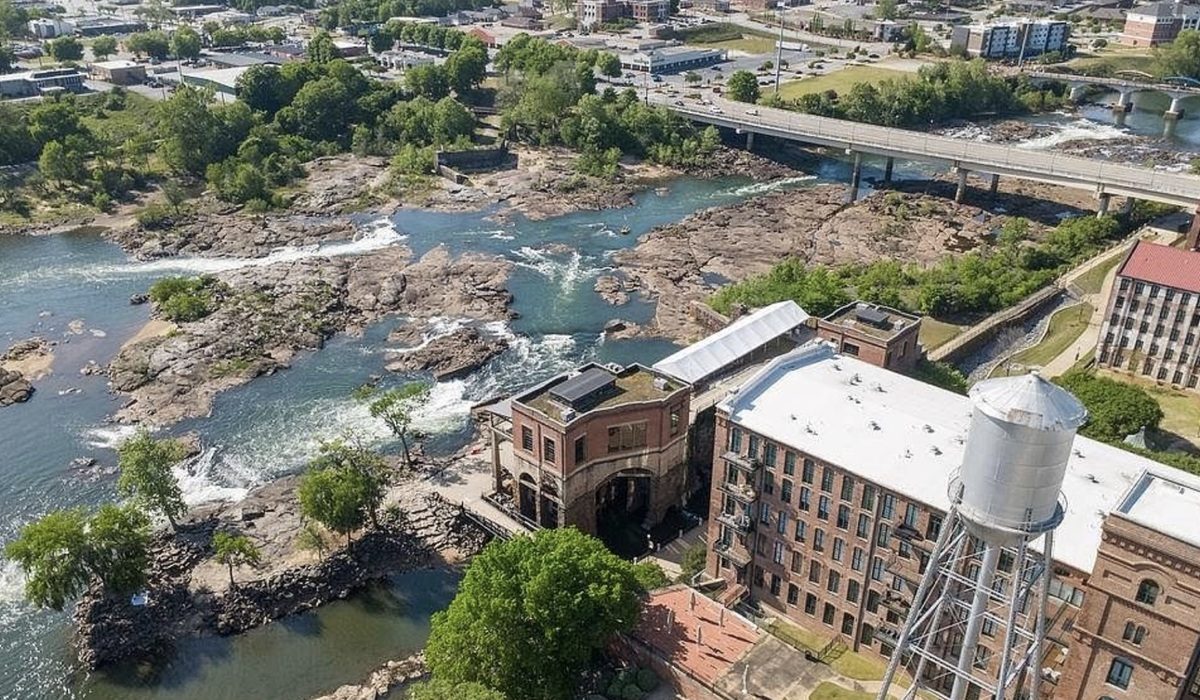 An aerial view of the historic Eagle & Phenix Mills and the Chattahoochee River rapids in Columbus, Georgia.