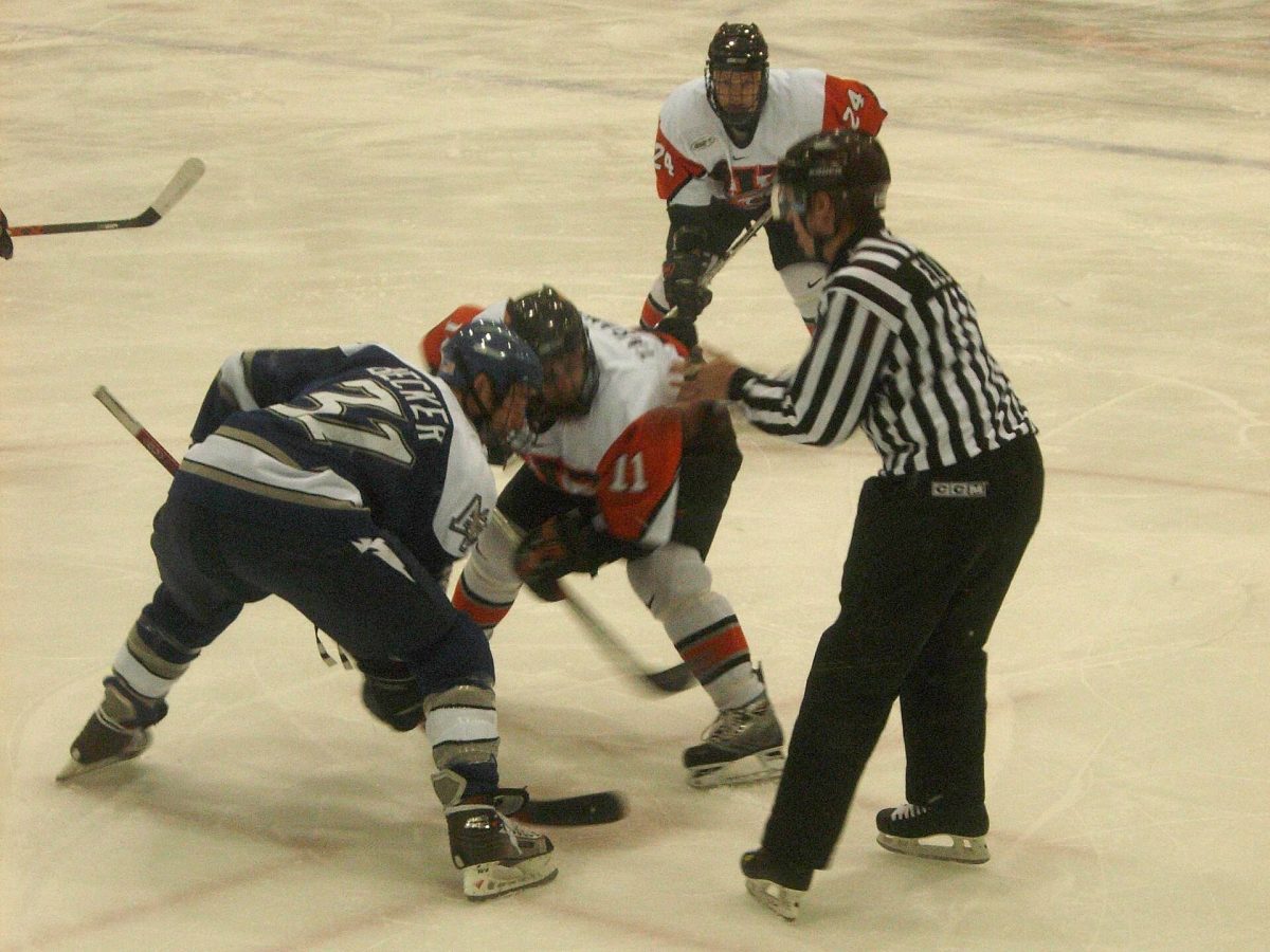 A faceoff during a college hockey game (file photo).