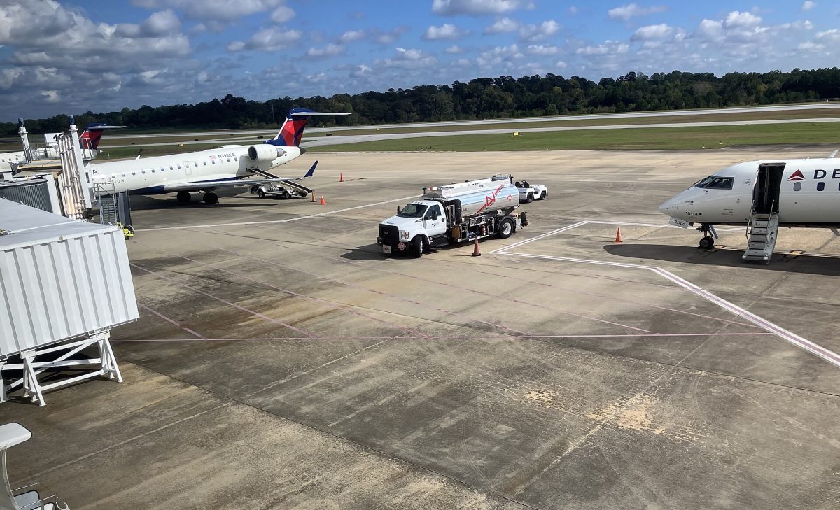 Three Delta Connection regional jets at the gates at Columbus Airport.