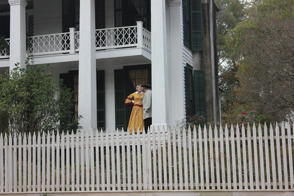 A columned house with a picket fence at Westville's former Lumpkin site in 2012.