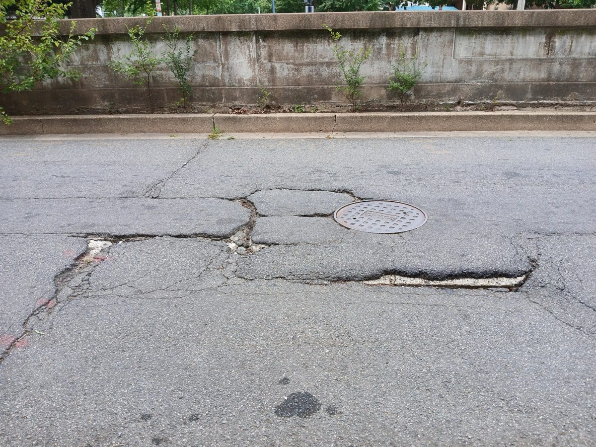 A pothole in a city street (file photo, Washington, D.C.).