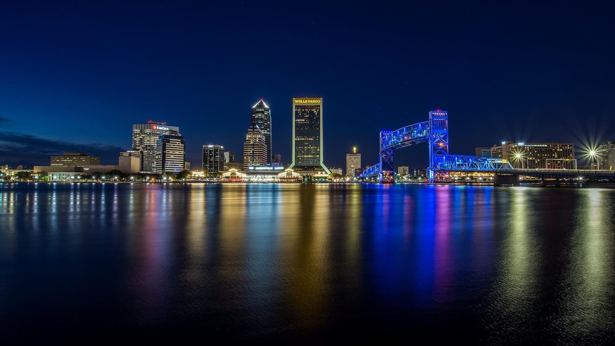 The Jacksonville skyline and the Main Street Bridge lit up at night over the St. Johns River (file photo).