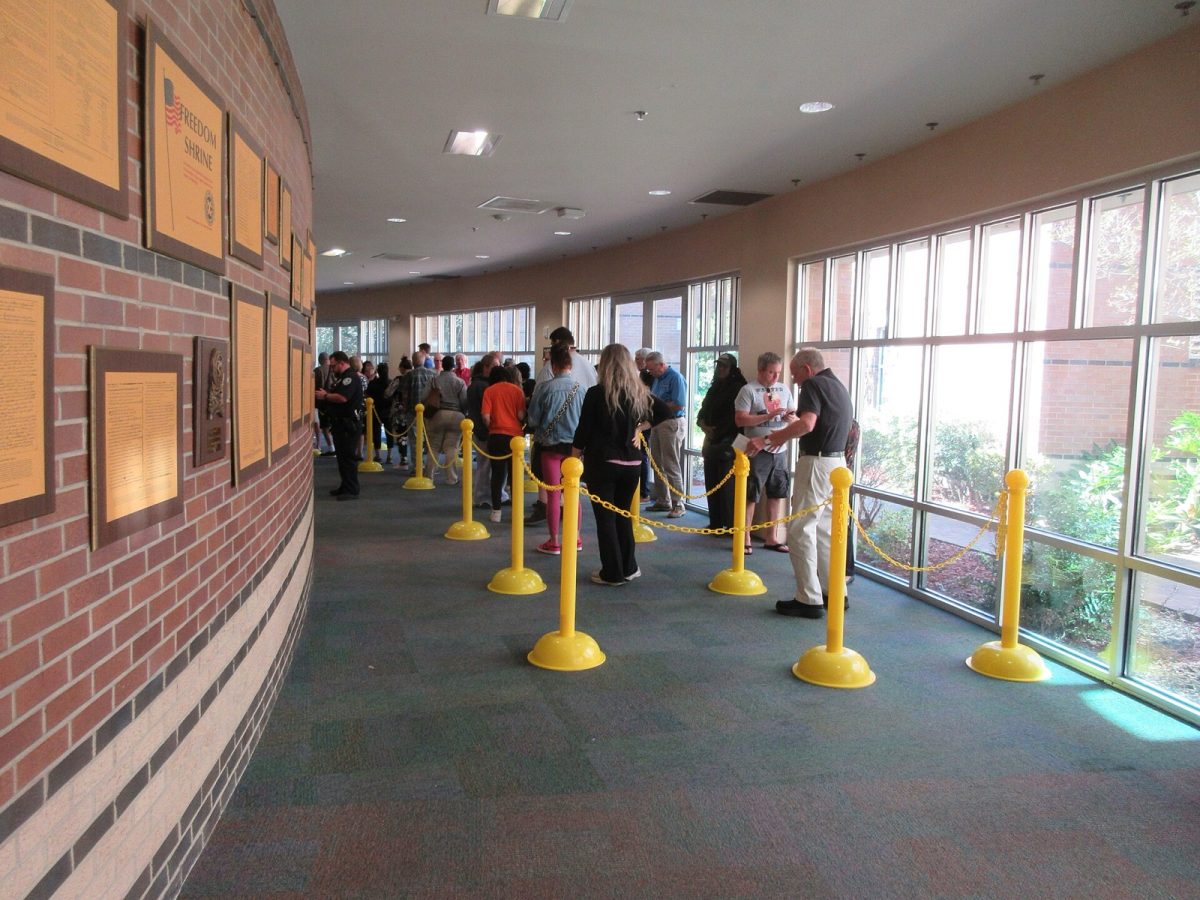 Voters wait in line for early voting at a public library in Metairie, La., in October 2024 (file photo).